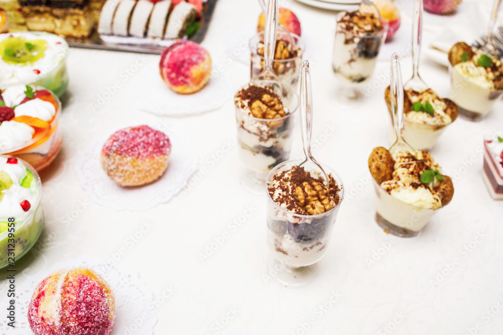 Modern desserts, cupcakes, sweets with fruits. Delicious candy bar. Catering Concept. Modern desserts, cupcakes, sweets with fruits. Delicious candy bar. Catering Concept.
