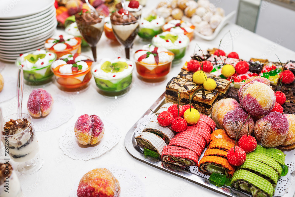 Modern desserts, cupcakes, sweets with fruits. Delicious candy bar. Catering Concept. Modern desserts, cupcakes, sweets with fruits. Delicious candy bar. Catering Concept.