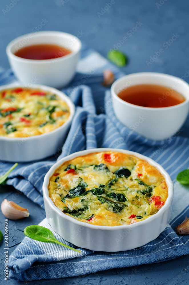 Spinach Red Bell Pepper Baked Omelet with cups of tea and fresh spinach leaves Spinach Red Bell Pepper Baked Omelet with cups of tea and fresh spinach leaves