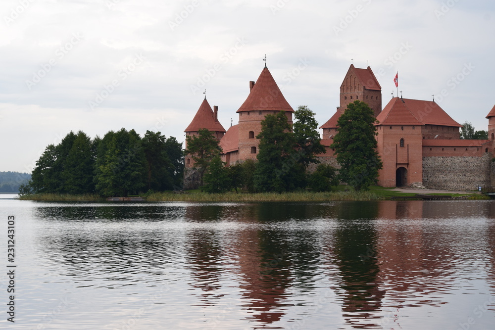 Trakai island castle at the lake. Reflection in water. Trakai island castle at the lake. Reflection in water.