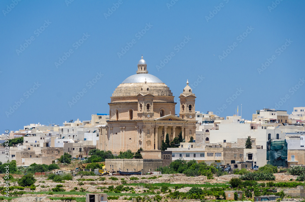 Ancient hilltop fortified capital city of Malta, The Silent City, Mdina or L-Imdina, blue skies with huge walls, cathedral domes and towers