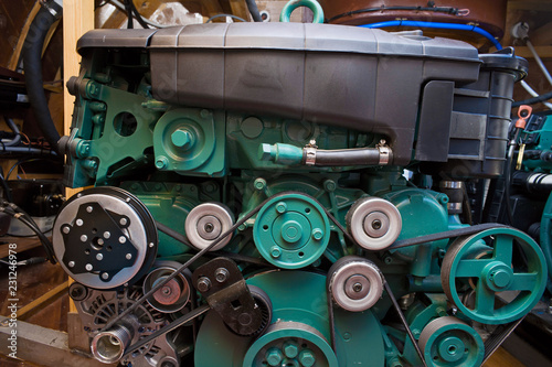 Metal internal combustion engine for a motor boat close-up in the compartment
