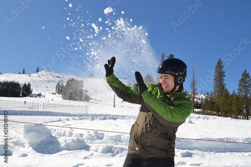 Playing with the Snow in a sunny day