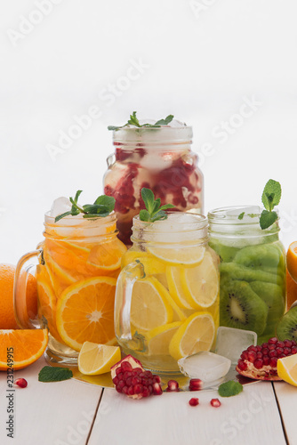 Fruit juices on a wooden white table. Useful and delicious vitamins. 