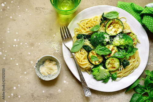 Spaghetti pasta with green vegetables (broccoli, spinach, grilled zucchini) .Top view.