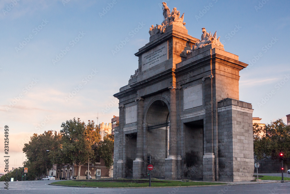 Historic monument Puerta de Toledo or Toledos gate in madrid. Autumn cityscape at sunrise. In Spain, Europe