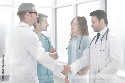handshake colleagues in the hospital corridor