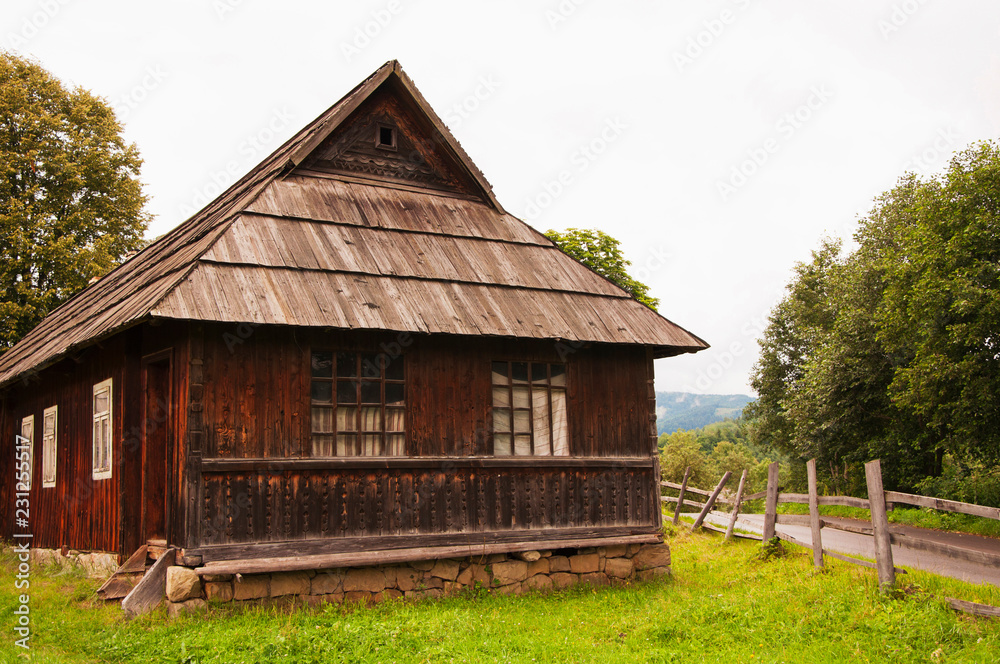 Old wooden village house in the mountains (concept ethnic)