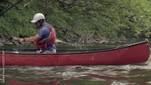 Canoe paddling upstream