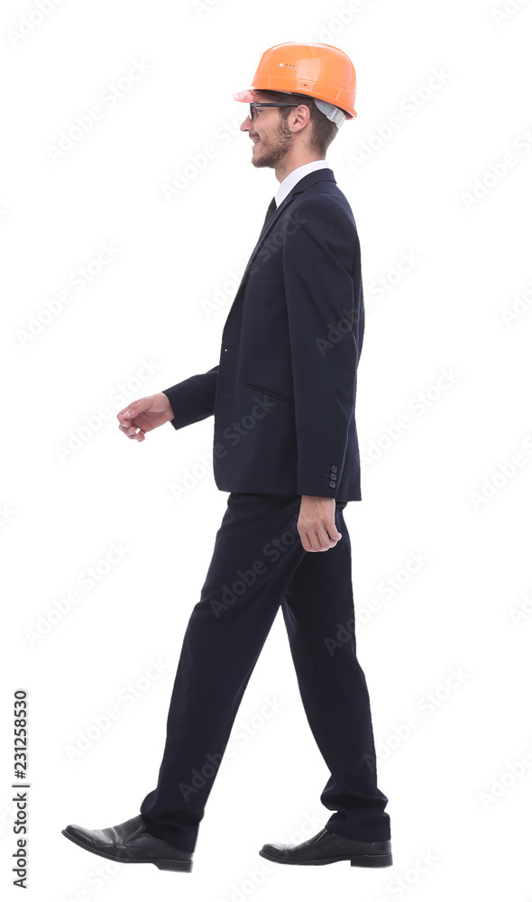 businessman in a protective helmet, stepping forward