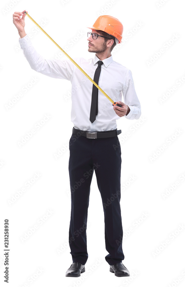 in full growth. young architect with yellow tape measure in full growth. young architect with yellow tape measure