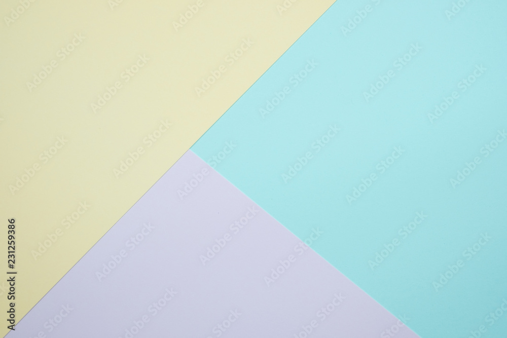 Fashionable  pastel colored paper flat lay top view, geometric background texture, pink, purple, yellow, beige, green and blue.