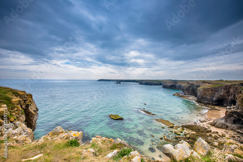 Scenic bay on Pembrokeshire coast  Uk.Turquoise sea rocky cliffs and dramatic sky.Beautiful landscape without people.