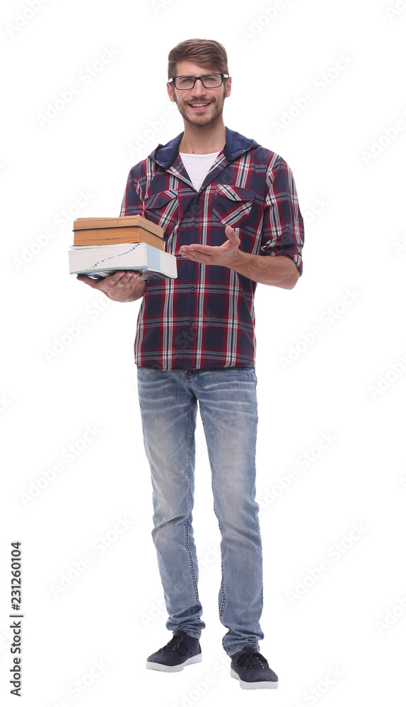 in full growth. smiling male student with books in full growth. smiling male student with books