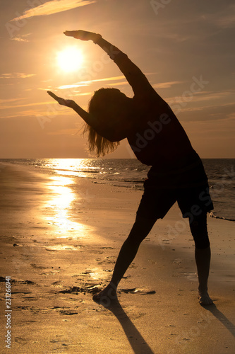 Yoga at sunrise on the beach at St Simons Island  GA