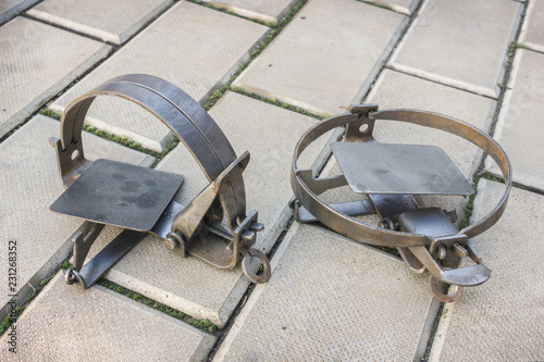 Two iron rusty traps on the stone floor