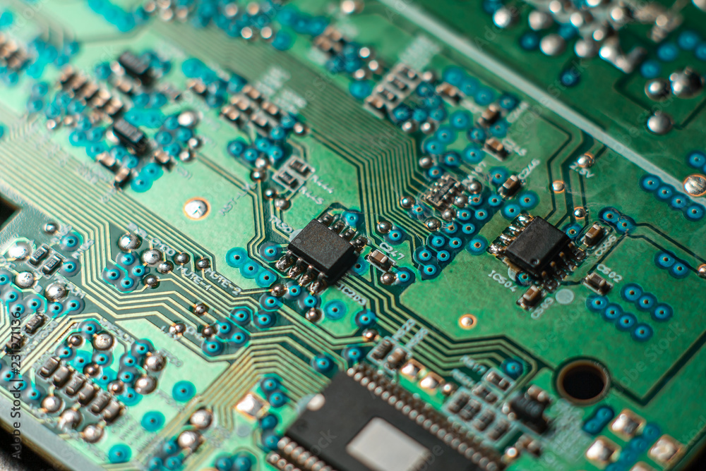 Obraz premium Minsk, Belarus, 2018. Computer chip on green motherboard closeup macro. Computer technology concept