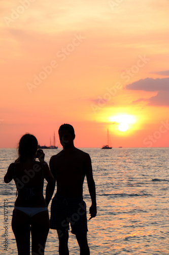 silhouette tourist On the beach Sunset © kathayut