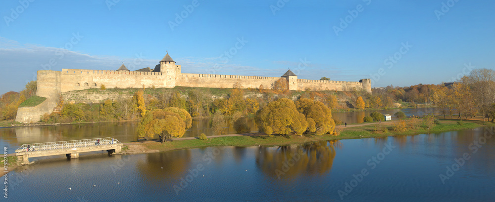 Panorama of the Ivangorod fortress in the golden autumn. Ivangorod, Russia