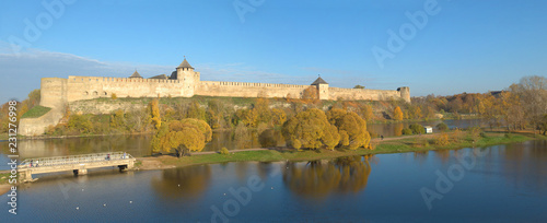 Panorama of the Ivangorod fortress in the golden autumn. Ivangorod, Russia