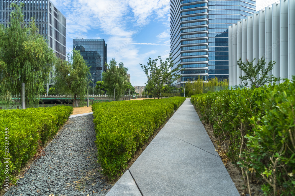 beautiful green meadow near modern office building. beautiful green meadow near modern office building.