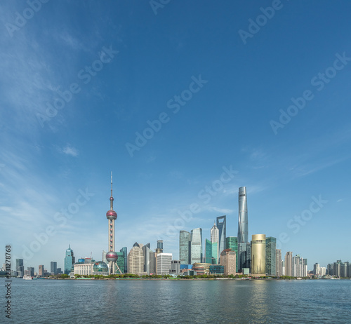 Shanghai skyline against blue sky