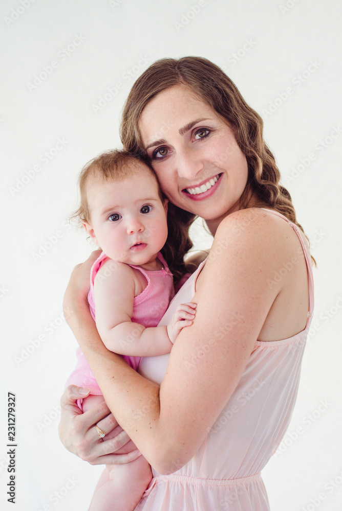 happy beautiful young mamma holding her 4 months old baby girl happy beautiful young mamma holding her 4 months old baby girl