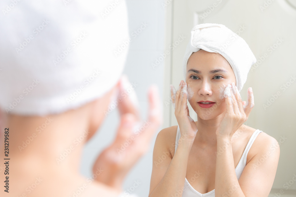 Asian woman cleaning face skin enjoy herself with bubble cleansing foam. Asian woman cleaning face skin enjoy herself with bubble cleansing foam.