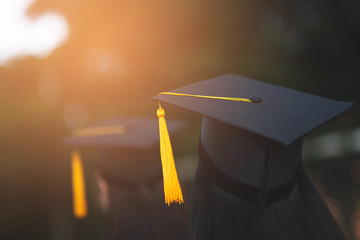 Back portrait of graduated wearing a black hat.