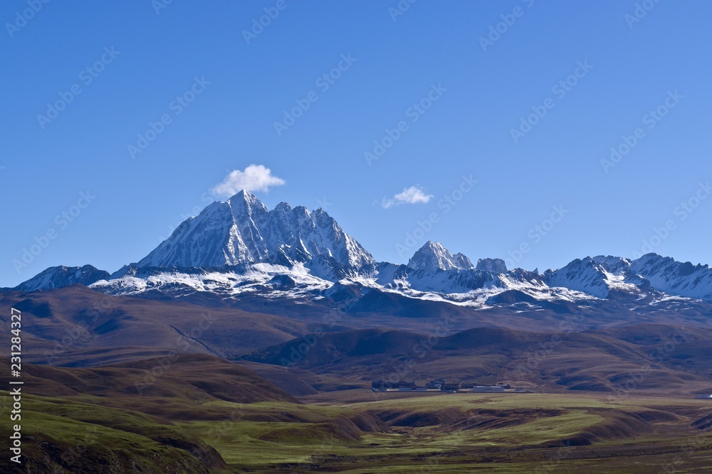 Fototapeta premium Tibetan holy mountain Mt. Yala with its summit at 5820m, taken from Tagong, Sichuan, China.