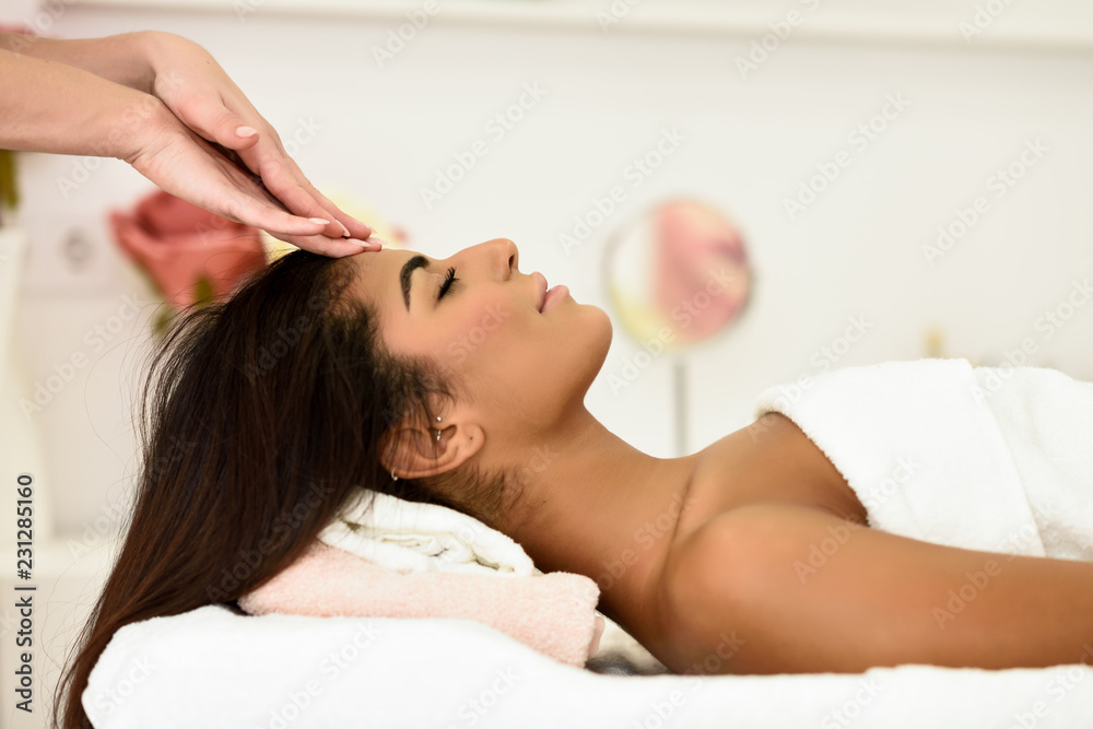 © javiindy - Woman receiving head massage in spa wellness center. © javiindy - Woman receiving head massage in spa wellness center.