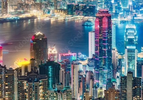 Scenic view on Hong Kong  China  by night. Multicolored nighttime skyline with illuminated skyscrapers seen from Victoria Peak