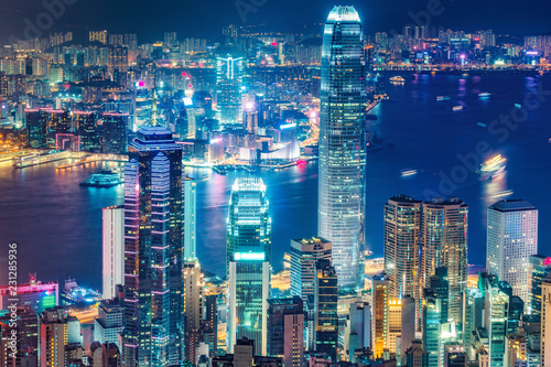 Scenic view over Hong Kong island  China  by night. Multicolored nighttime skyline with illuminated skyscrapers seen from Victoria Peak