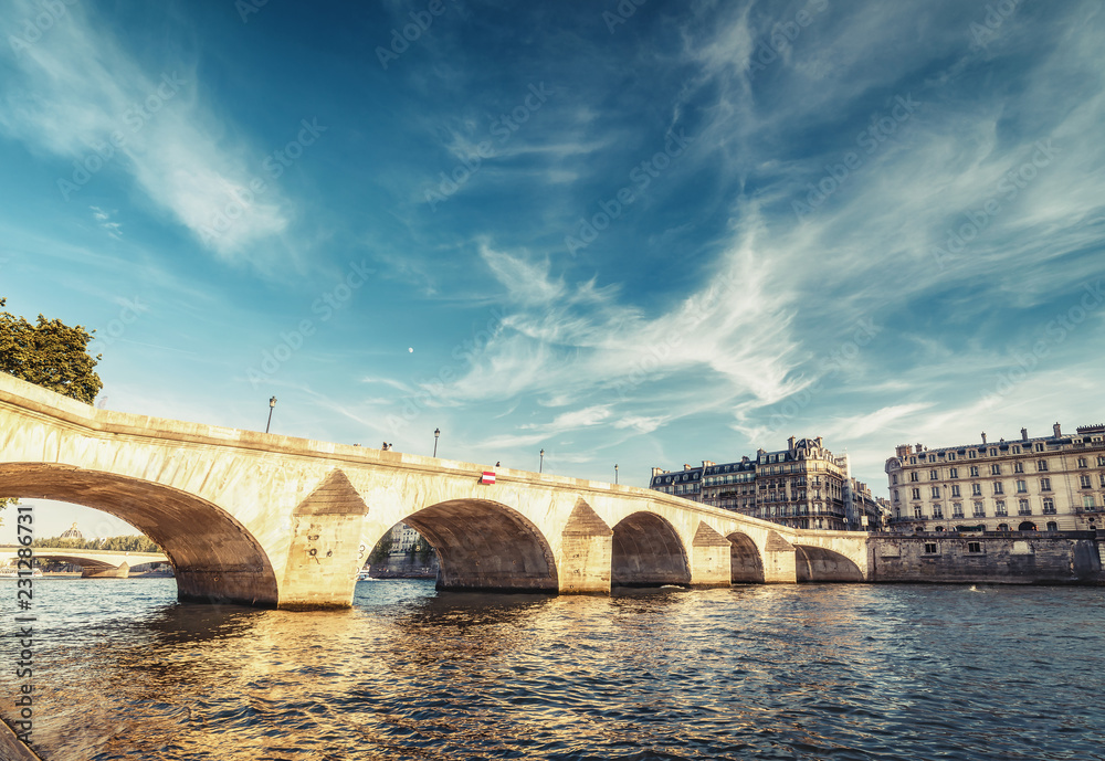 Bridge over Seine river in Paris, France at daytime. Travel and architectural background.
