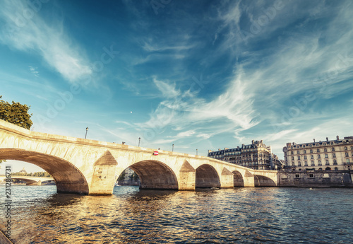Bridge over Seine river in Paris, France at daytime. Travel and architectural background.