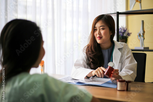 Beautiful physician medicine doctor or pharmacist reading notes of boxes medicine,Medical care, pharmacy or insurance concept