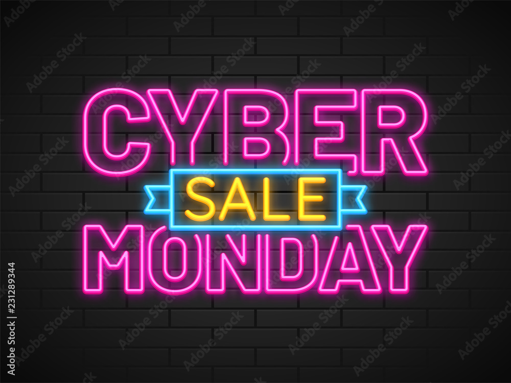 Neon text Cyber Monday Sale in pink and yellow color on brick wall background.