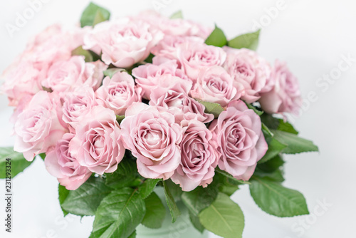 Roses lilac and pastel colors. Bright bouquet in metal bucket. concept of flower shop. © malkovkosta