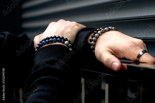 Men's bracelets on hand photo