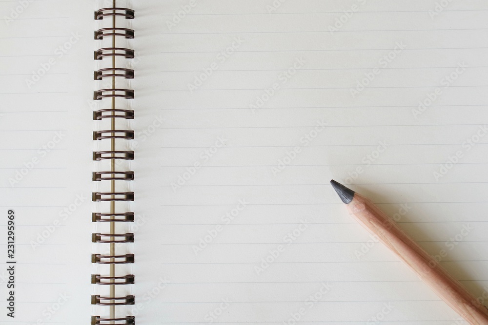 Pencil and notebook. Pencil and notebook.
