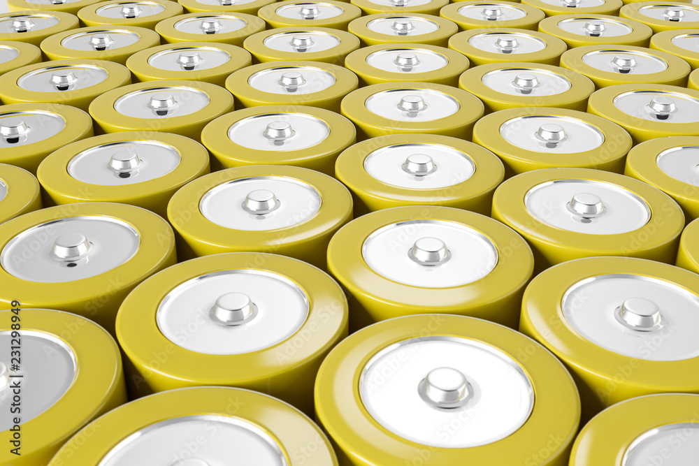 Rows of yellow alkaline batteries Rows of yellow alkaline batteries