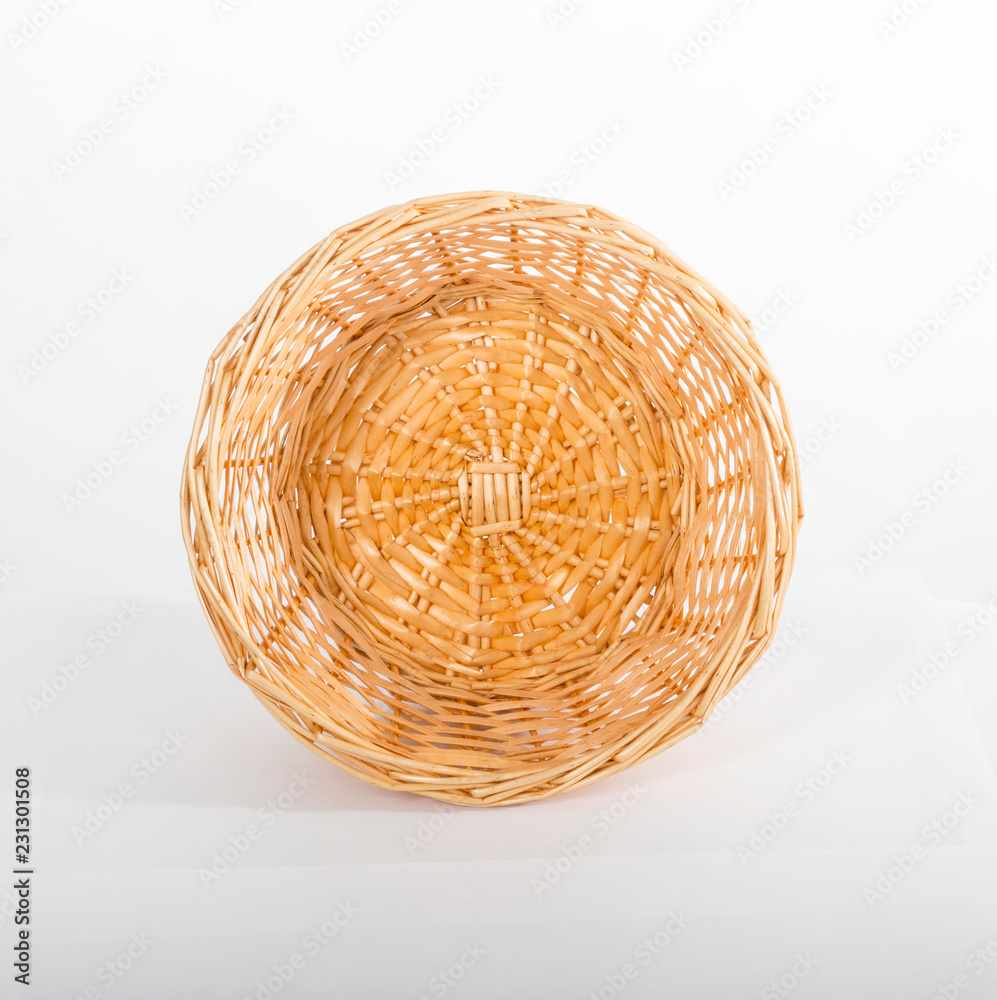 Fototapeta premium Empty yellow wicker basket top view