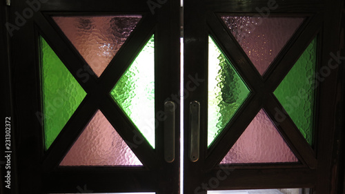 Swing doors with colored glass windows