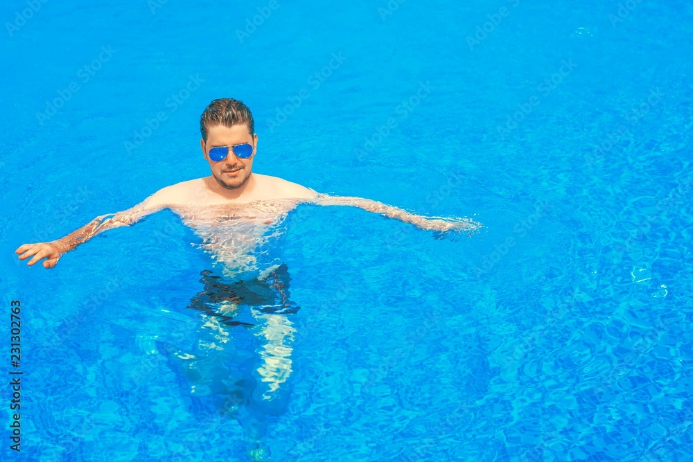 Man swimming in the pool.