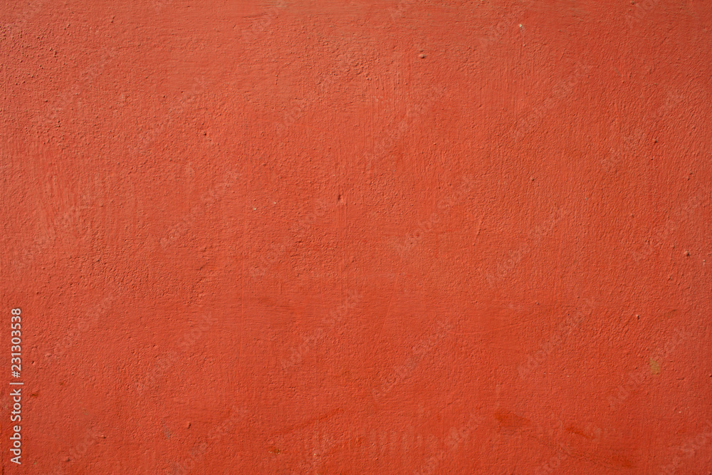 red rough concrete wall with paint smudges red rough concrete wall with paint smudges