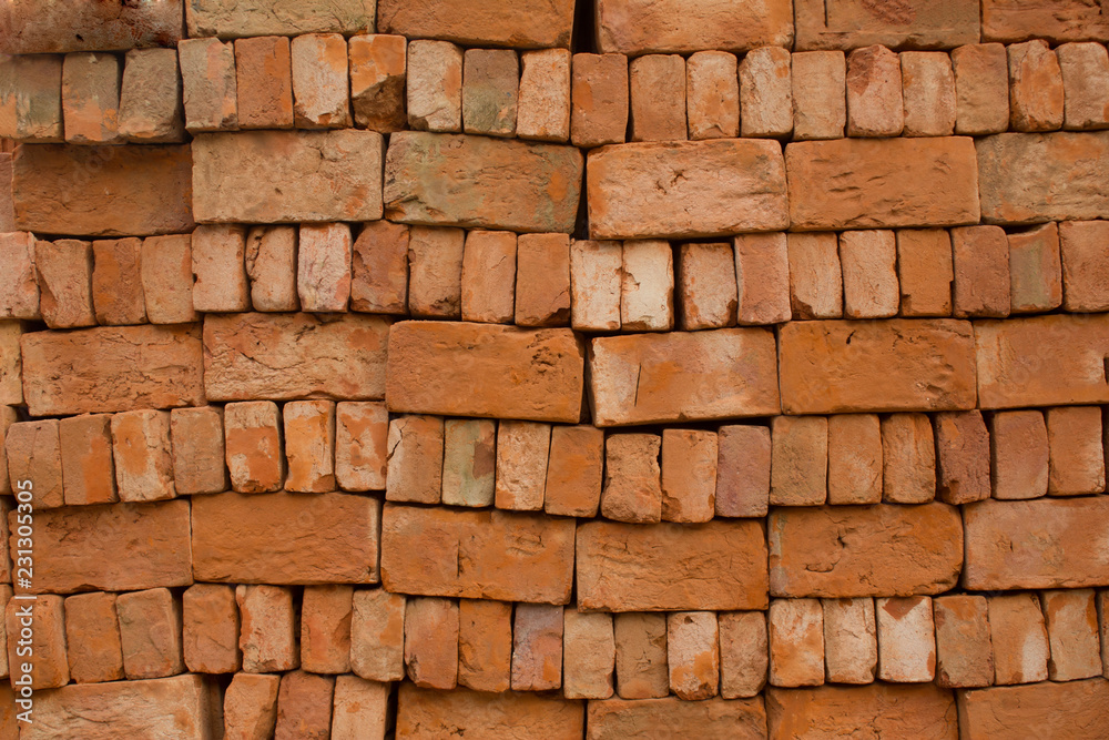 Obraz premium stacked red bricks with rough roughness