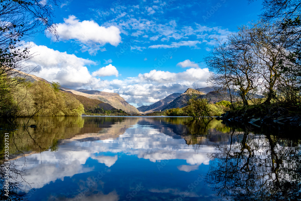 Reflections at Llyn Padarn with Dolbadarn Castle at Llanberis in Snowdonia National Park in background - Wales