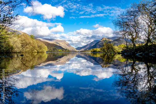 Reflections at Llyn Padarn with Dolbadarn Castle at Llanberis in Snowdonia National Park in background - Wales