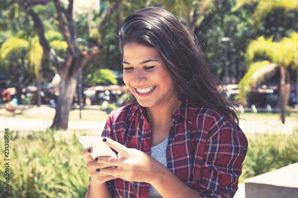 Caucasian woman sending message with phone