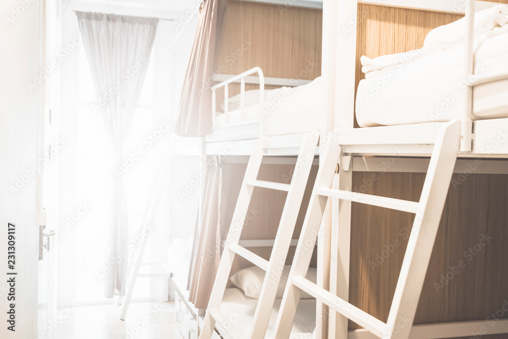 Beds inside the hostel room for tourists or the students blurred for background banner